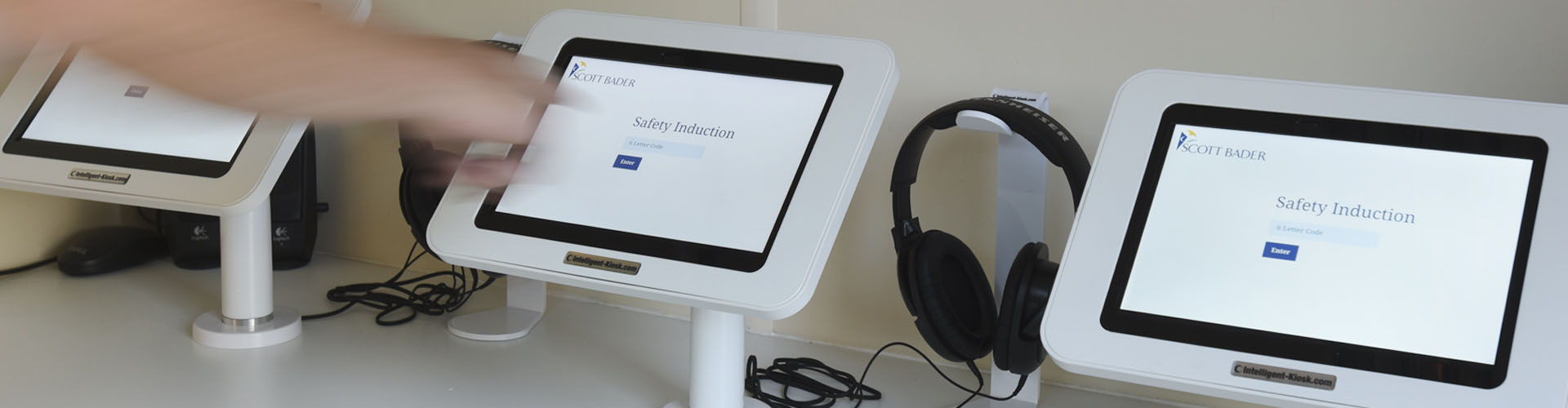 contractor entering a code into a health and safety induction software kiosk