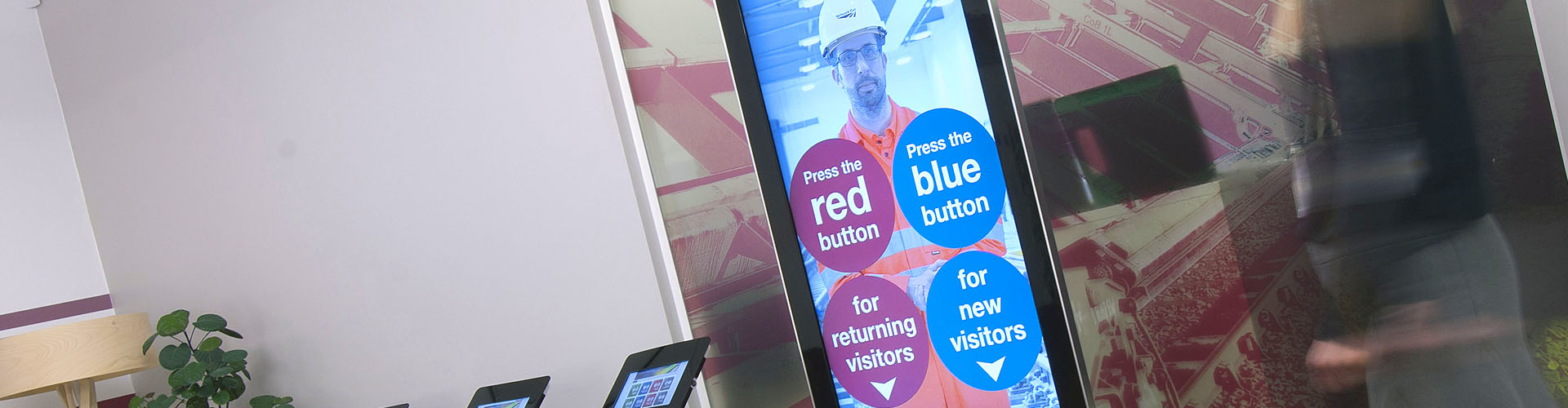 Life size health and safety visitor, contractor, employee induction kiosk Black health and safety visitor, contractor, employee induction kiosk with network rail branding